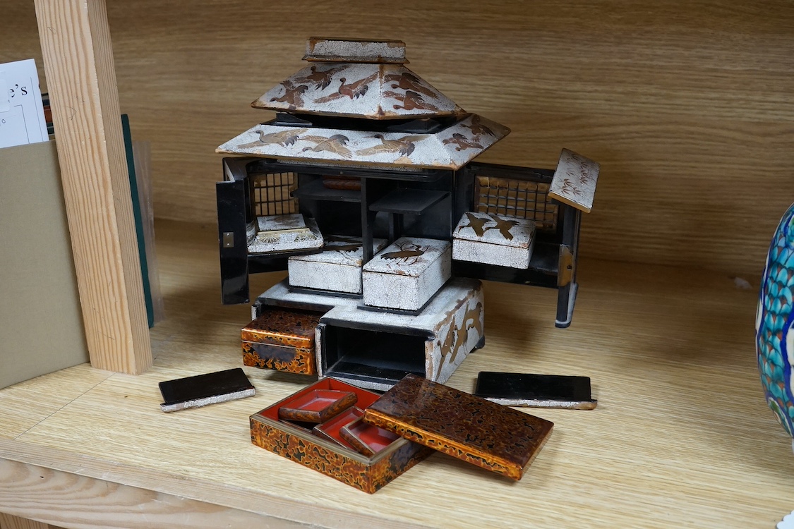 An early 20th century Japanese lacquer cabinet in the form of a temple, 23cm. Condition - fair